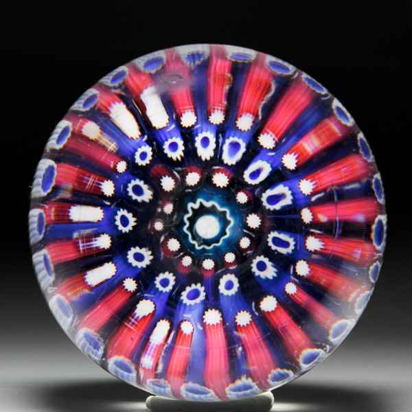 Post-classic English close concentric millefiori footed paperweight. by Post-classic English