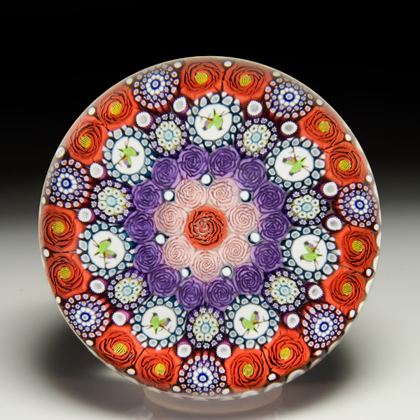 Mike Hunter 2023 close concentric millefiori, silhouettes, kingfisher murrini and roses paperweight. by Twists Glass Studio
