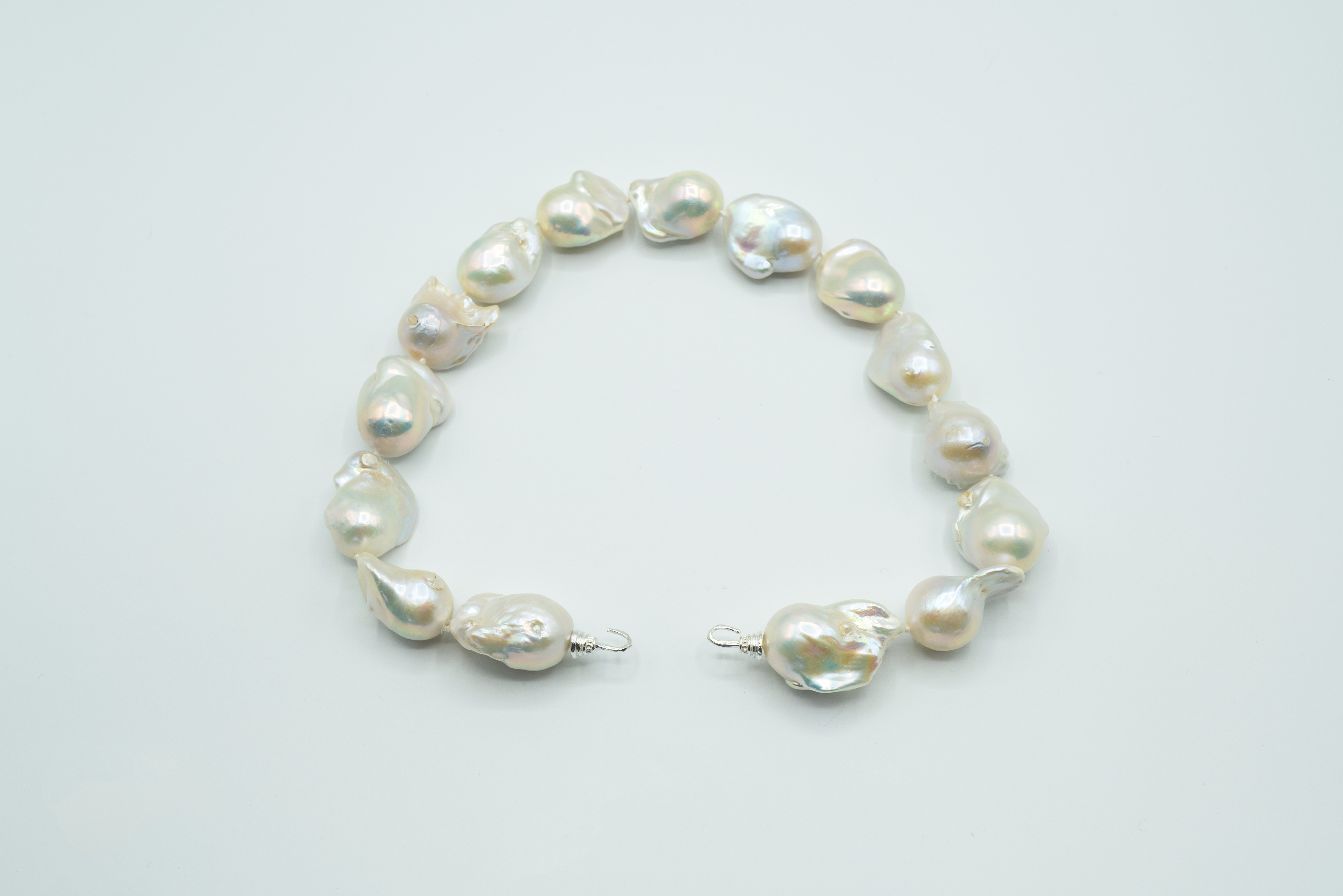 Jumbo Freshwater Baroque Pearls, Smooth Texture Hand Knotted on Hand Cast Sterling Hooks. Unusual and rare pearls approx.