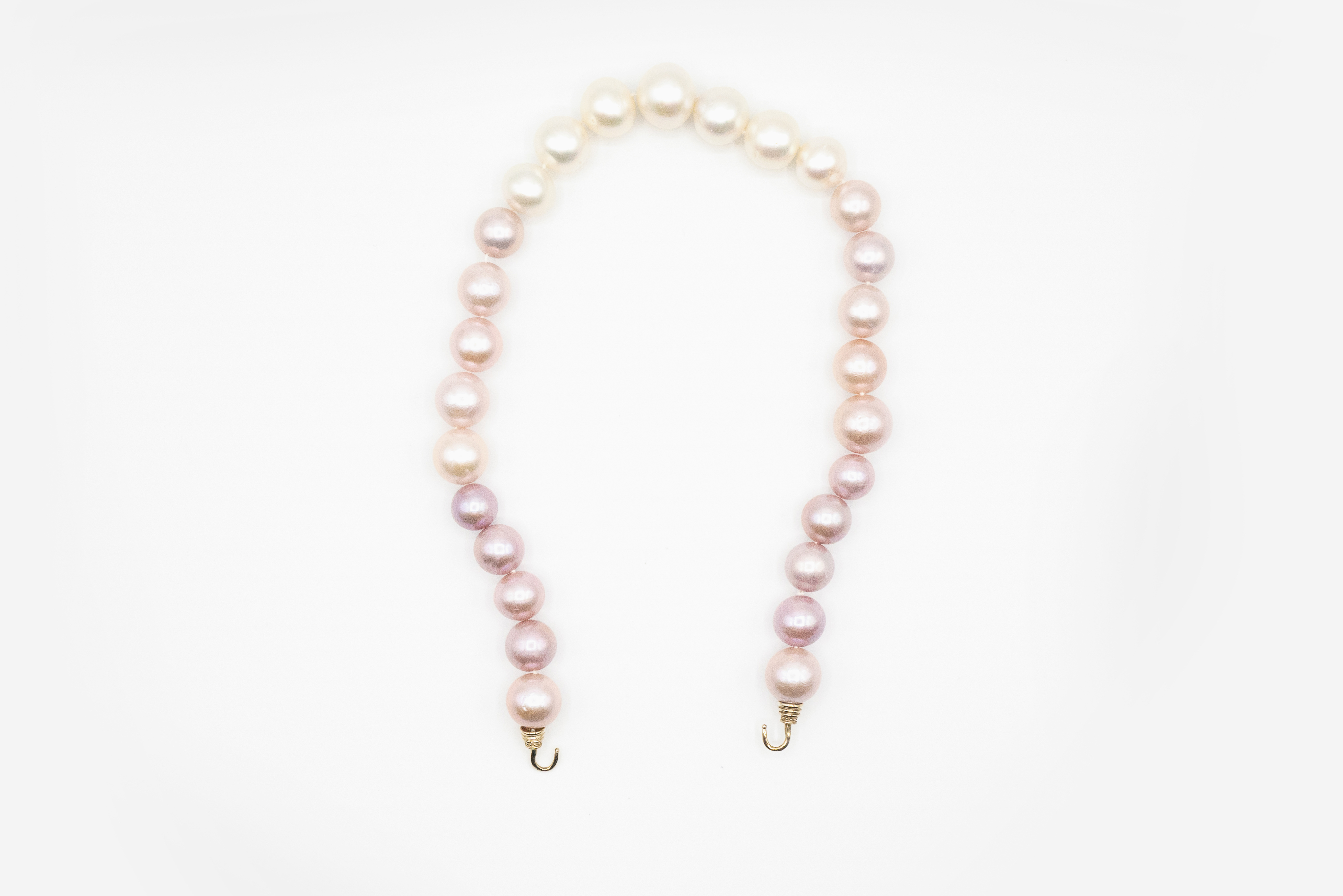 MAB 21-0117 Natural Colored Pink and White South Sea Pearl Strand on 14kw Gold Hooks.