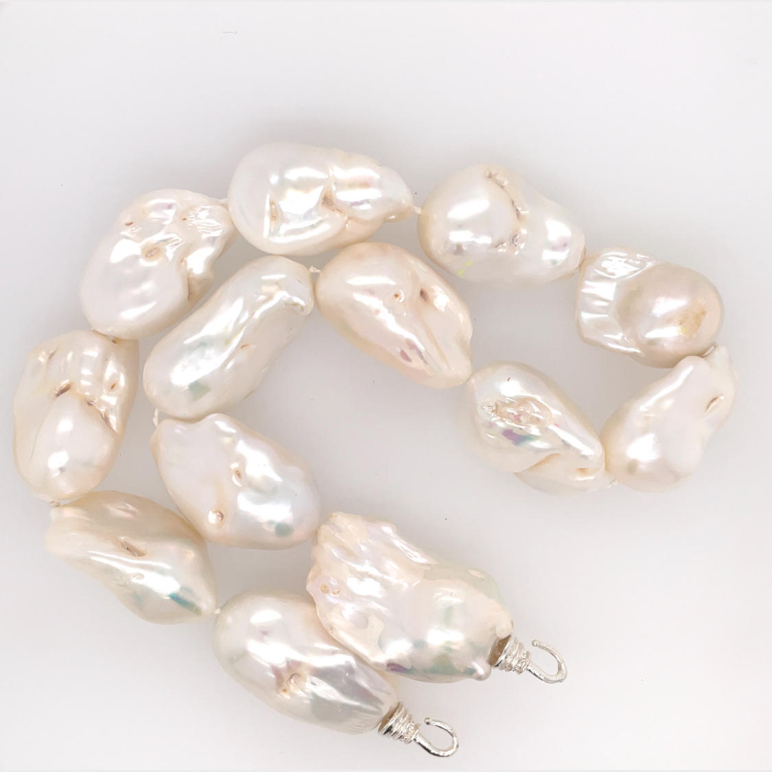 Jumbo Freshwater Elongated Baroque Pearls, Hand Knotted on Hand Cast Bronze Hooks. Unusual and rare pearls approx.