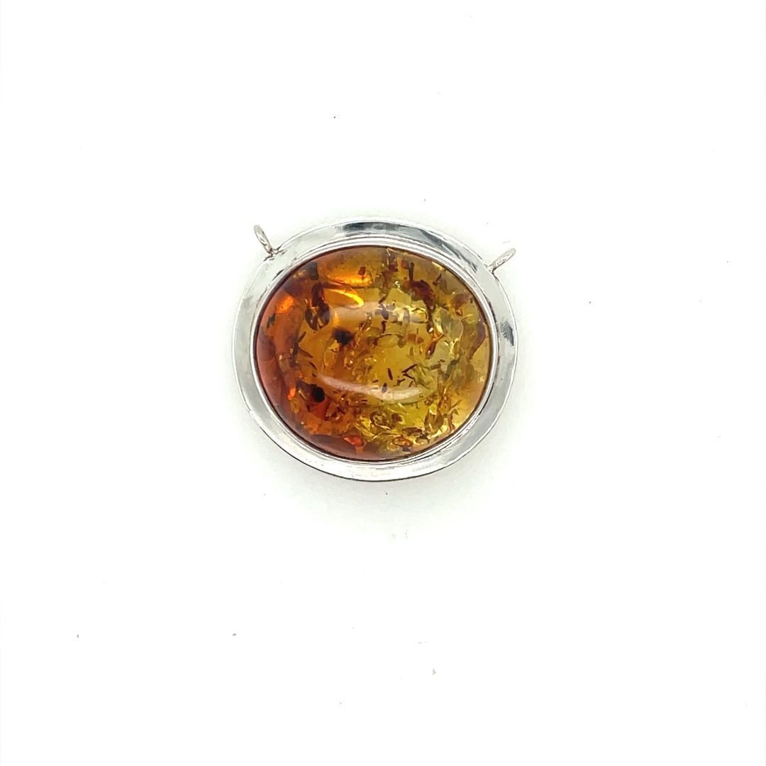 Natural Amber and sterling silver centerpiece. Silver has been lacquered, so it should not tarnish.