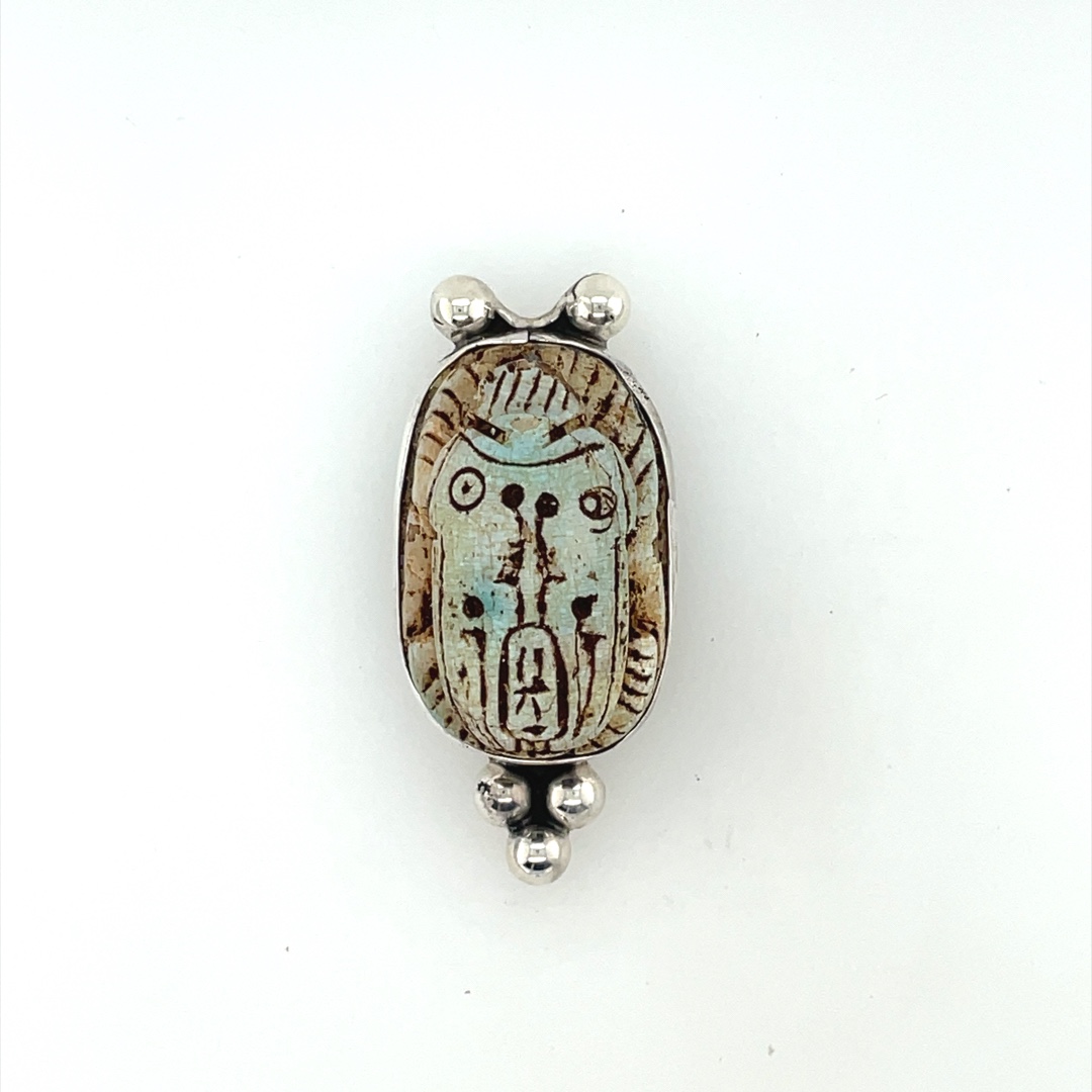 Gray blue hand carved scarab centerpiece with sterling motifs. Sterling is lacquered, so it should not tarnish.