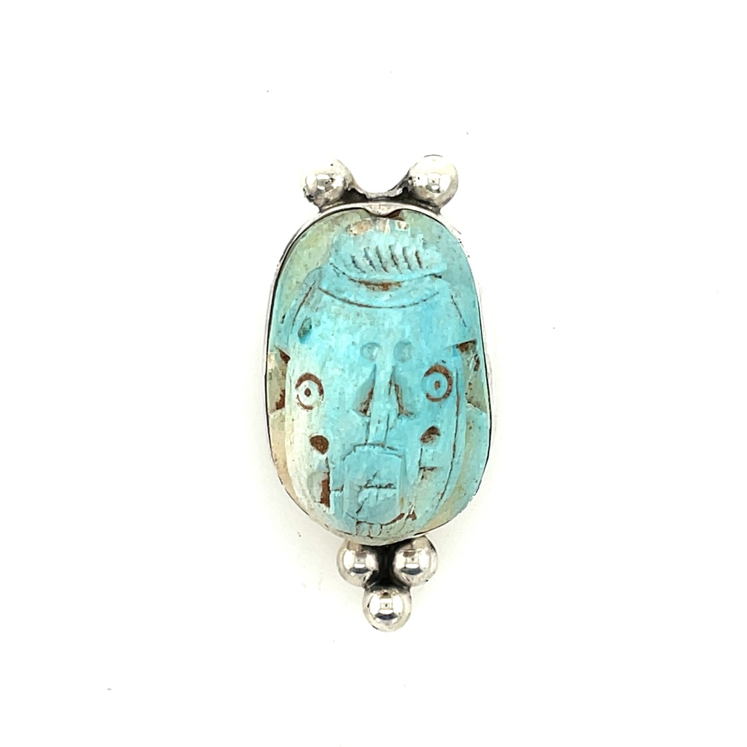 Soft aqua blue hand carved scarab centerpiece with sterling motifs. Sterling is lacquered, so it should not tarnish.