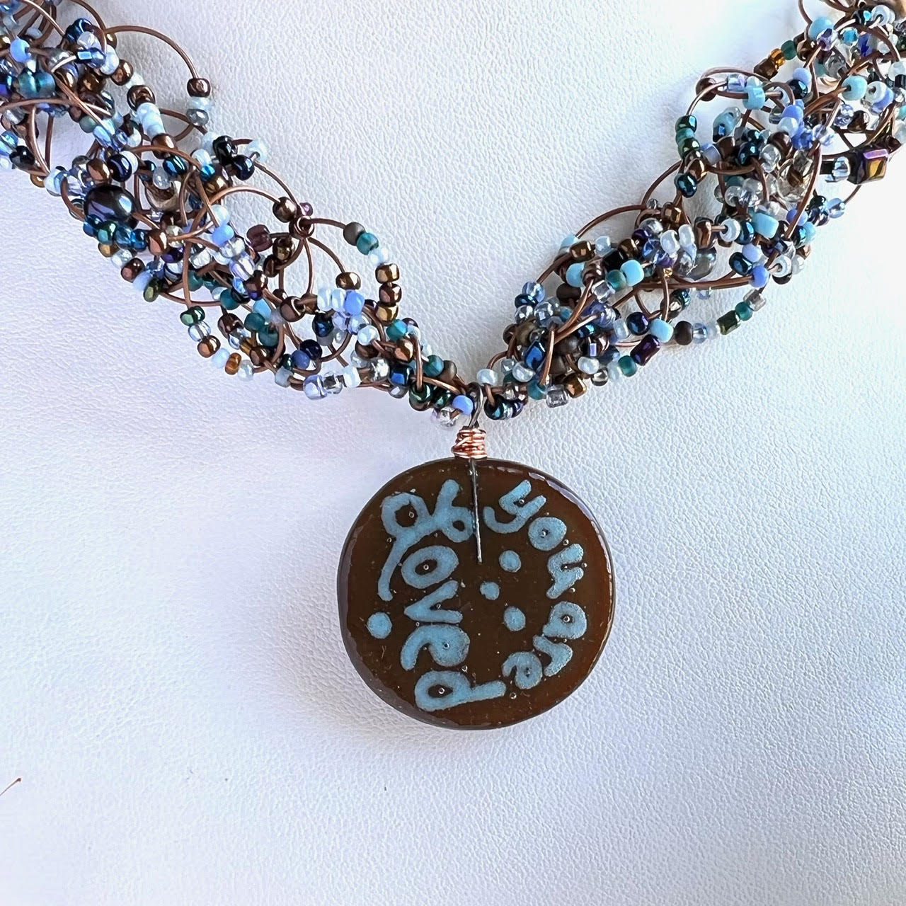 YOU ARE LOVED Fused Glass Brown and Light Blue Woven Necklace