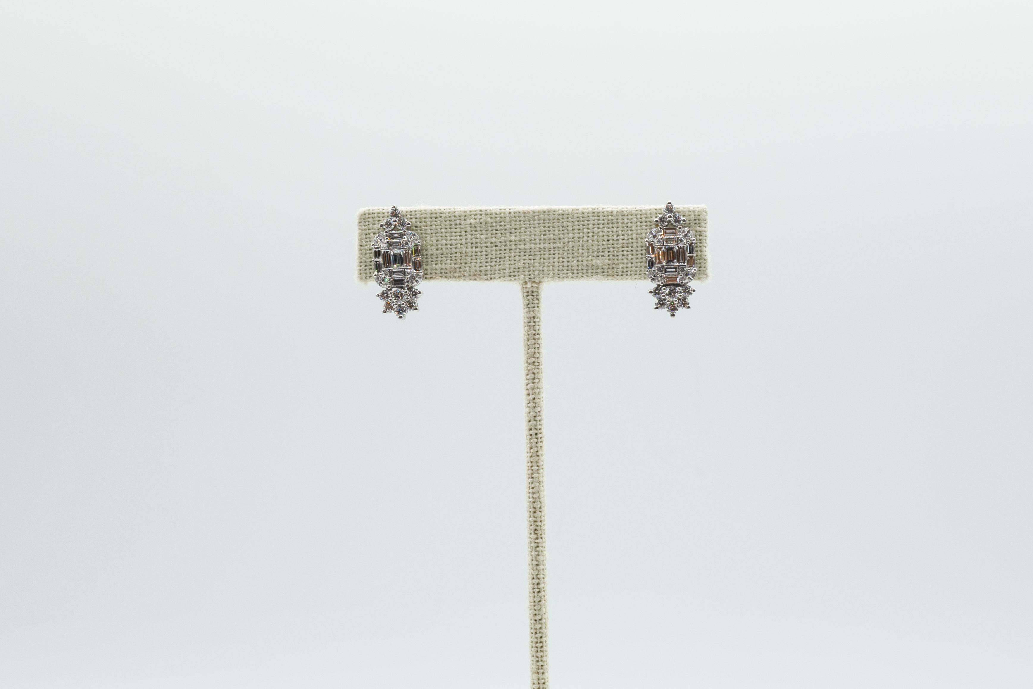 Modern Take on Classic Diamond Dress Clips as Earrings in 18k White Gold. Diamond weight 2.4 carats.  Hidden Hook on Back